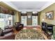 Cozy living room with hardwood floors, natural light, and elegant furnishings offers a comfortable space at 3401 Cresta Ct, Charlotte, NC 28269
