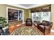 Relaxing living room with hardwood floors and a view into dining room is perfect for entertaining guests at 3401 Cresta Ct, Charlotte, NC 28269