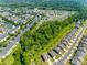 An aerial view of a community with sidewalks, landscaping and well-maintained lawns and homes at 3849 Carl Parmer Dr, Harrisburg, NC 28075