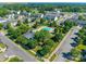 Aerial view of a neighborhood featuring a community pool and well-manicured green spaces at 3849 Carl Parmer Dr, Harrisburg, NC 28075