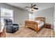 Bedroom with wood-look floors, ceiling fan and windows with natural light at 3849 Carl Parmer Dr, Harrisburg, NC 28075