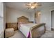 Bedroom featuring a ceiling fan, and a large bed with decorative headboard and side tables at 3849 Carl Parmer Dr, Harrisburg, NC 28075