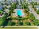 Community pool featuring a large rectangular pool, lounge chairs, and a covered pavilion at 3849 Carl Parmer Dr, Harrisburg, NC 28075