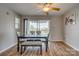 Dining area with seating for six and sliding glass doors to the outside at 3849 Carl Parmer Dr, Harrisburg, NC 28075