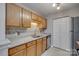 Functional kitchen with wood cabinets, granite countertops, and stainless steel appliances at 3849 Carl Parmer Dr, Harrisburg, NC 28075