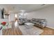 Comfortable living room with two sofas, a mirrored table, and stylish decor on wood floors at 3849 Carl Parmer Dr, Harrisburg, NC 28075