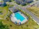 Aerial view of neighborhood pool and recreational area with green space and a picnic pavilion at 3849 Carl Parmer Dr, Harrisburg, NC 28075
