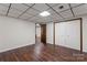 Finished basement area boasts wood-look floors, and an open door and closet for ample storage space at 3943 Peggy Ln, Mint Hill, NC 28227