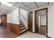 Basement entrance features a stairway, tile flooring, paneled walls, and hardwood flooring at 3943 Peggy Ln, Mint Hill, NC 28227
