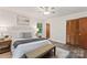 Cozy bedroom featuring a plush bed, warm accents, and a closet for ample storage space at 3943 Peggy Ln, Mint Hill, NC 28227