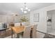 Formal dining room featuring natural light and open floor plan to living room and kitchen at 3943 Peggy Ln, Mint Hill, NC 28227
