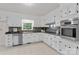 Updated kitchen features modern appliances, granite countertops, and bright white cabinetry at 3943 Peggy Ln, Mint Hill, NC 28227