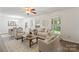 Bright living room with neutral decor, large windows, and a view of the dining area at 3943 Peggy Ln, Mint Hill, NC 28227