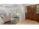 Inviting living room featuring new flooring, natural light, and a stylish entryway with a wooden door at 3943 Peggy Ln, Mint Hill, NC 28227