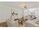 Inviting living room featuring modern decor and neutral color palette flowing into a dining area at 3943 Peggy Ln, Mint Hill, NC 28227