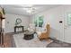 Comfortable living room with hardwood floors, a fireplace, and natural light at 3943 Peggy Ln, Mint Hill, NC 28227