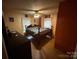 Cozy bedroom with a floral comforter, hardwood floors, and a ceiling fan at 407 Alton St, Monroe, NC 28110