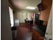 Functional kitchen featuring an eat-in-kitchen table, dark cabinetry, and a black refrigerator at 407 Alton St, Monroe, NC 28110