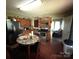 Functional kitchen featuring tile backsplash, stainless steel appliances, and a breakfast table at 407 Alton St, Monroe, NC 28110