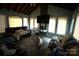 Large living room with a high ceiling featuring tile flooring, a couch, and large windows at 407 Alton St, Monroe, NC 28110