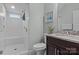 Bathroom with a walk-in shower featuring white subway tile and a hexagon tile floor at 423 Solomon St, Charlotte, NC 28216