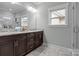 Bathroom with double vanity, granite counters, and modern fixtures at 423 Solomon St, Charlotte, NC 28216