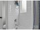 Bathroom shower and tub featuring white subway tile, chrome shower head, and a blue shower curtain at 423 Solomon St, Charlotte, NC 28216