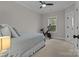 Bedroom featuring carpet and a ceiling fan with a stationary bike and window at 423 Solomon St, Charlotte, NC 28216