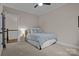 Bedroom with a full-sized bed featuring carpet and neutral paint at 423 Solomon St, Charlotte, NC 28216