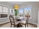 Cozy breakfast nook featuring a round table, seating for four, and natural light from large windows at 423 Solomon St, Charlotte, NC 28216