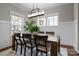 Bright dining room with natural light, a wooden table, seating for six, and stylish decor at 423 Solomon St, Charlotte, NC 28216