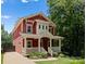 Charming two-story home with a welcoming front porch and landscaped yard, perfect for a Gathering at 423 Solomon St, Charlotte, NC 28216
