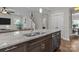 Stylish kitchen island with granite countertops and stainless steel dishwasher, offering modern convenience at 423 Solomon St, Charlotte, NC 28216