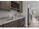 Elegant wet bar with granite countertops, a wine rack, and a mini-fridge, perfect for entertaining at 423 Solomon St, Charlotte, NC 28216