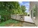 Well maintained deck with table and grill and lovely surrounding trees at 4462 Kellybrook Dr, Concord, NC 28025