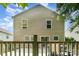 A home's exterior featuring a deck, neutral siding, and large windows at 4462 Kellybrook Dr, Concord, NC 28025