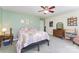 Bright bedroom featuring neutral walls, a cozy bed, a ceiling fan, and a dresser at 4462 Kellybrook Dr, Concord, NC 28025