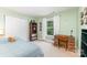Cozy bedroom with a desk, a comfortable bed, and a large window at 4462 Kellybrook Dr, Concord, NC 28025