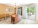 Bright dining area with a wooden table, classic chairs, and sliding glass doors to the outdoor deck at 4462 Kellybrook Dr, Concord, NC 28025