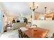 The dining area adjoins the living room and features a light fixture and an adjacent outdoor deck at 4462 Kellybrook Dr, Concord, NC 28025