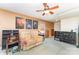 Second entertainment room boasts a ceiling fan, built-in bookshelves, and a comfortable seating area at 4462 Kellybrook Dr, Concord, NC 28025