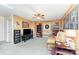 Entertainment room boasts a ceiling fan, built-in bookshelves, and a comfortable seating area at 4462 Kellybrook Dr, Concord, NC 28025