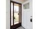 Bright entryway featuring a white front door with glass accents and a view of the home's exterior at 4601 Mendham Dr, Charlotte, NC 28215