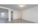 Hallway view with fresh paint and trim, showcasing access to other rooms at 4601 Mendham Dr, Charlotte, NC 28215