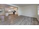 Spacious kitchen with white cabinets, stainless steel appliances, and open layout to Gathering room at 4601 Mendham Dr, Charlotte, NC 28215