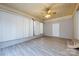 Sunroom boasts painted brick, updated floors, and access to other rooms in the home at 4601 Mendham Dr, Charlotte, NC 28215