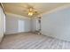 Painted brick sunroom with updated floors and access to backyard and other parts of home at 4601 Mendham Dr, Charlotte, NC 28215