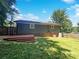 Exterior view of home's back with wood deck and green, grassy area at 4903 Jamee Dr, Gastonia, NC 28056