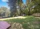 Spacious backyard with mature trees and a charming shed, perfect for outdoor activities and relaxation at 4903 Jamee Dr, Gastonia, NC 28056