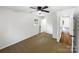 Inviting bedroom with a window, ceiling fan, neutral carpet, and access to an en-suite bathroom at 4903 Jamee Dr, Gastonia, NC 28056